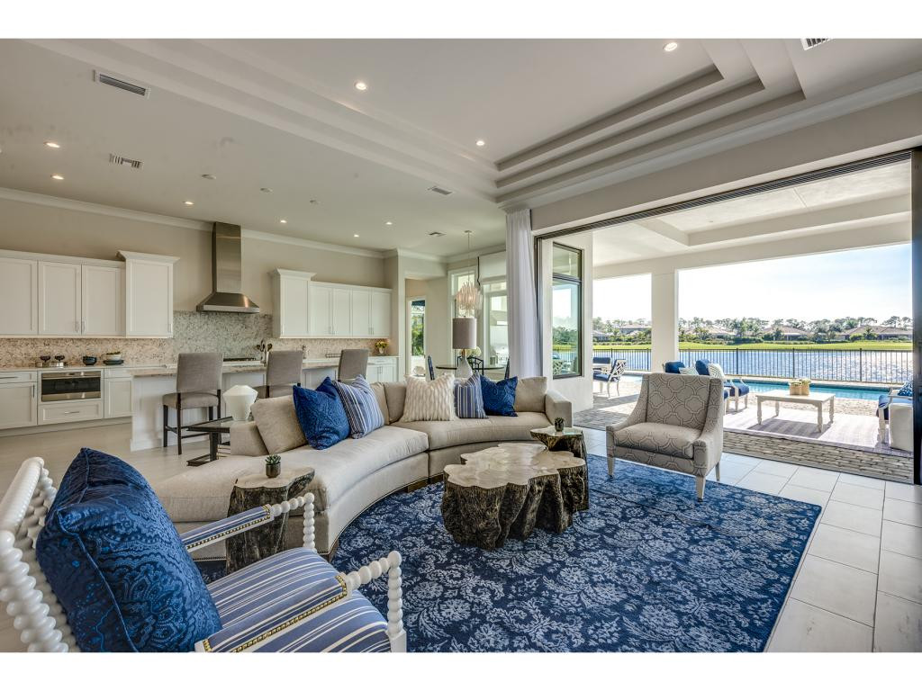 9828 Montiano Place Naples, FL 34113 - Photo 13 of 18 a living room with furniture and a large window