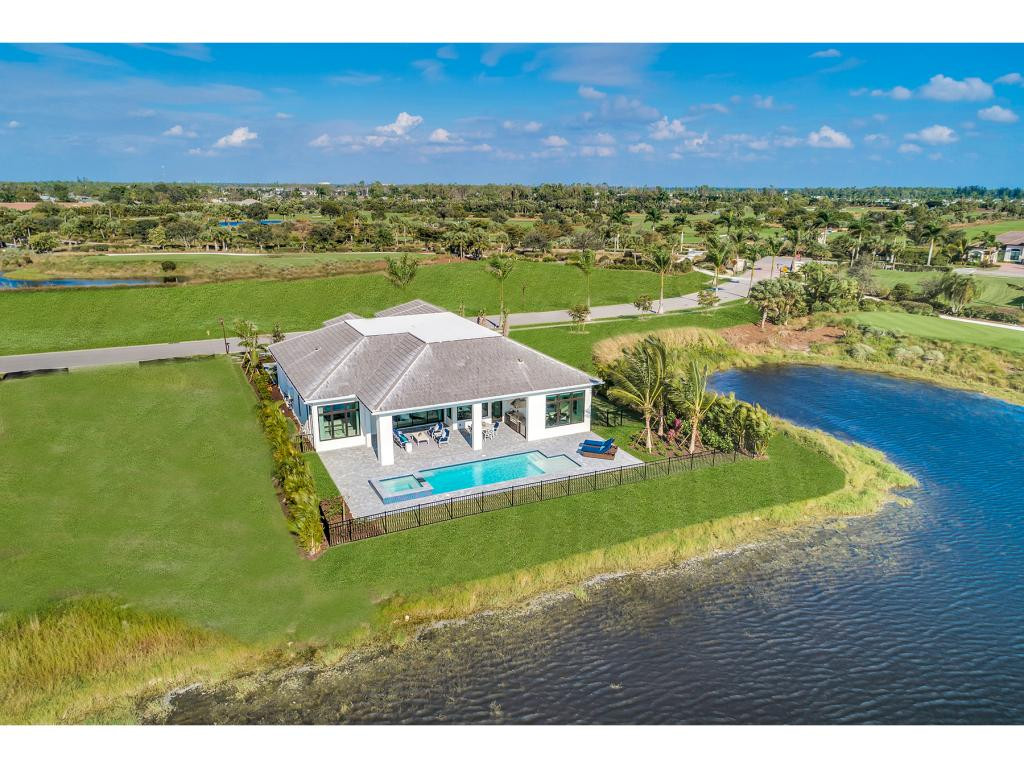 9828 Montiano Place Naples, FL 34113 - Photo 7 of 18 a view of a big room with a yard