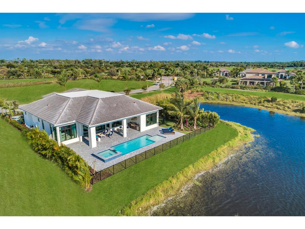 9828 Montiano Place Naples, FL 34113 - Photo 8 of 18 a view of a house with a yard