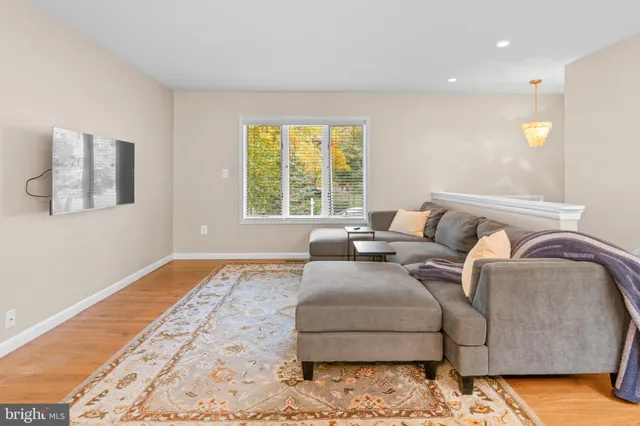 a living room with furniture and a rug