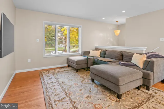 a living room with furniture and a rug