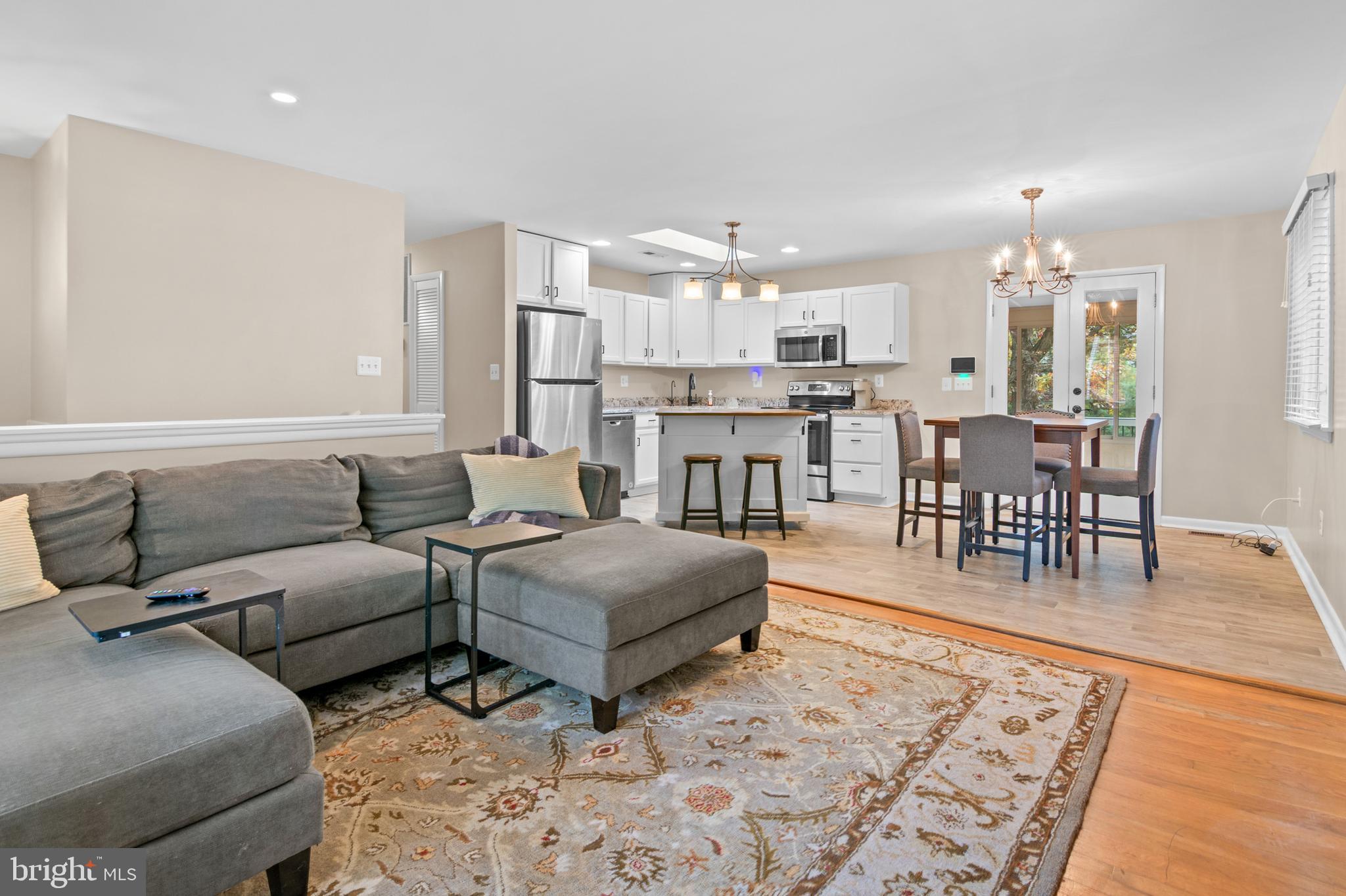 2709 Parkview Drive Riva, MD 21140 - Photo 21 of 53 a living room with furniture a dining table and a view of kitchen