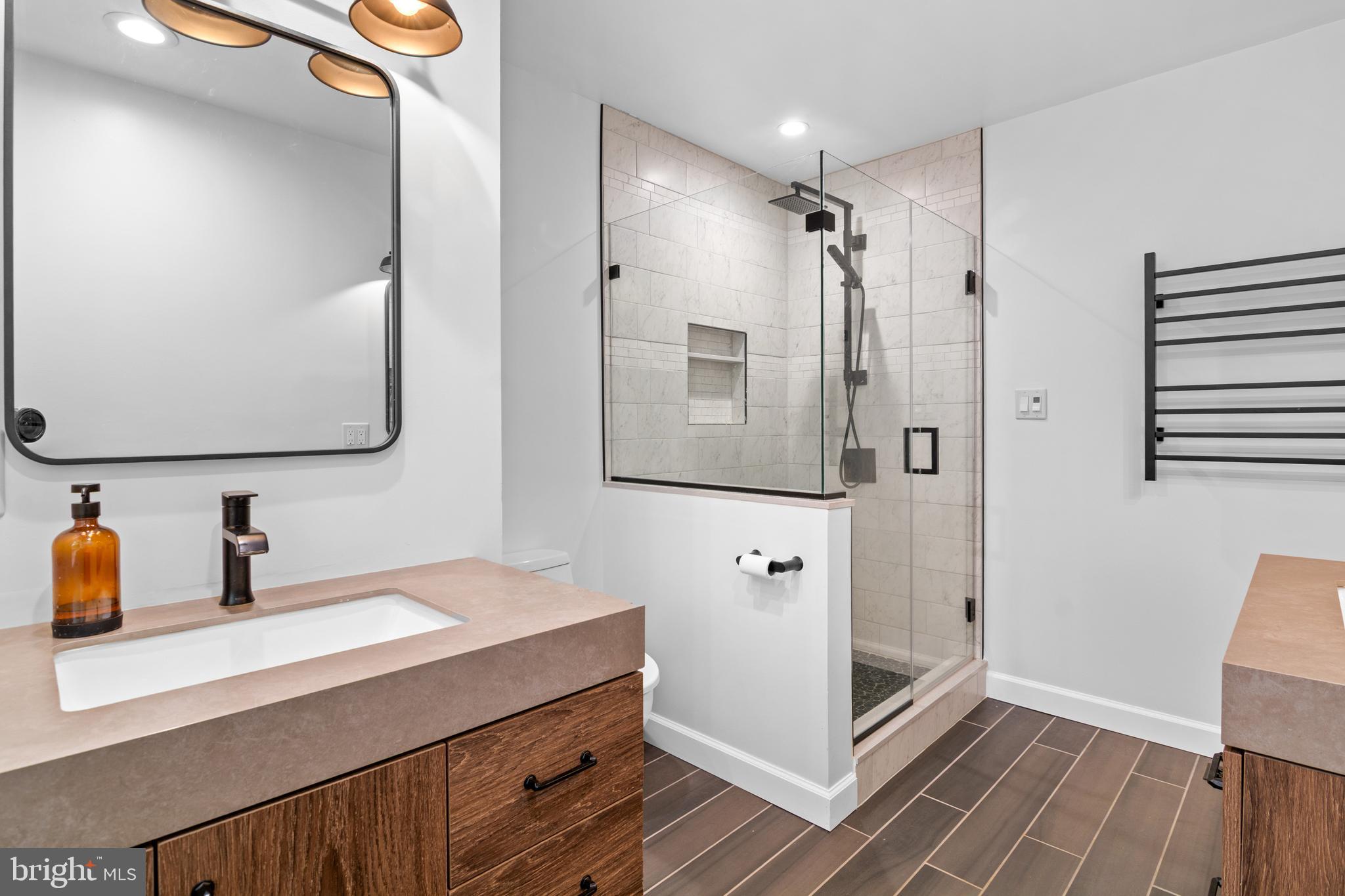 2709 Parkview Drive Riva, MD 21140 - Photo 31 of 53 a bathroom with a double vanity sink mirror and shower