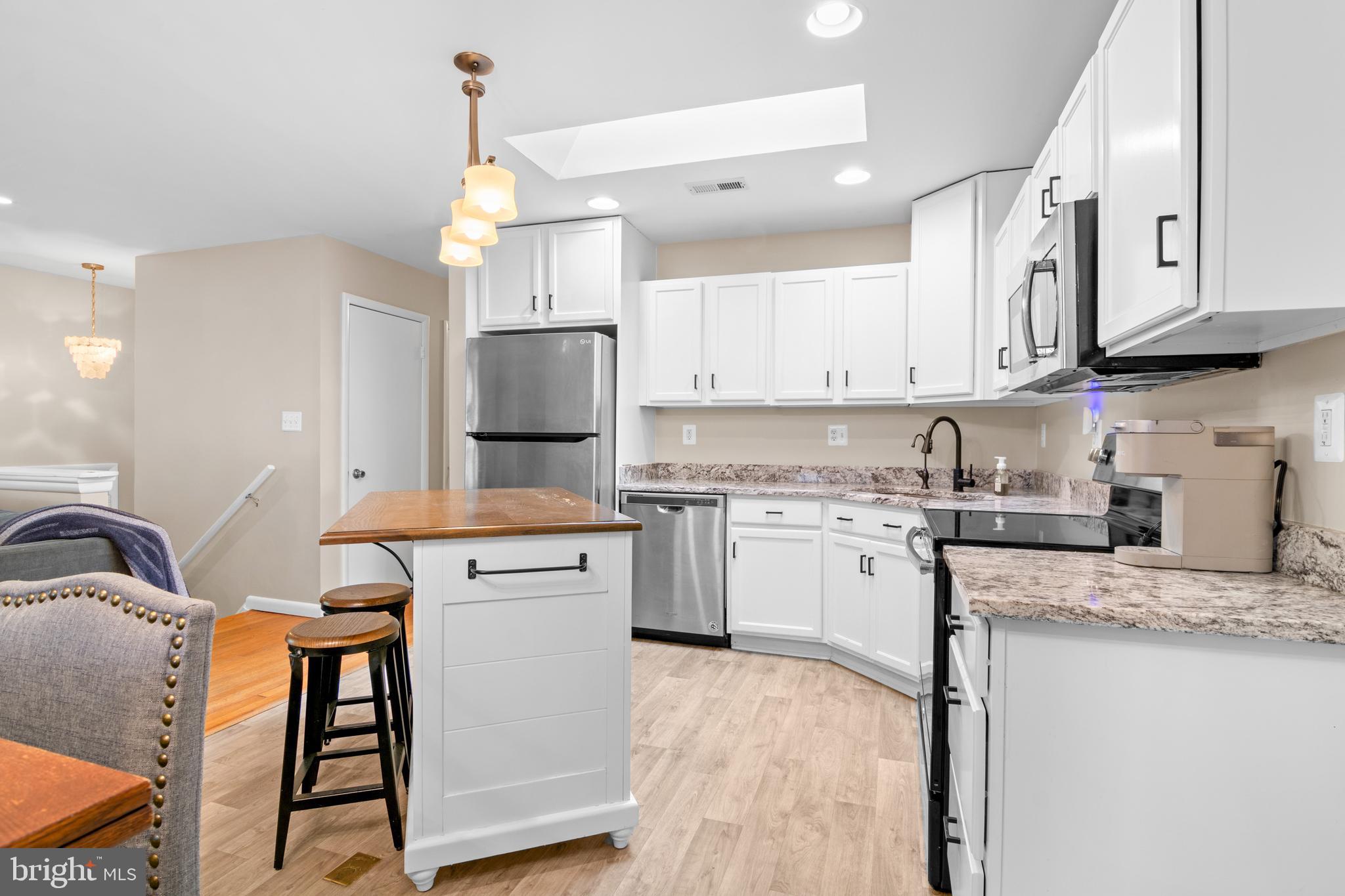 2709 Parkview Drive Riva, MD 21140 - Photo 10 of 53 a kitchen with stainless steel appliances granite countertop a stove refrigerator sink and cabinets
