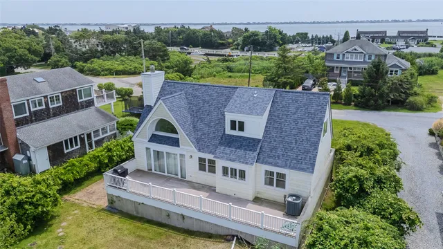 an aerial view of a house with a garden and plants