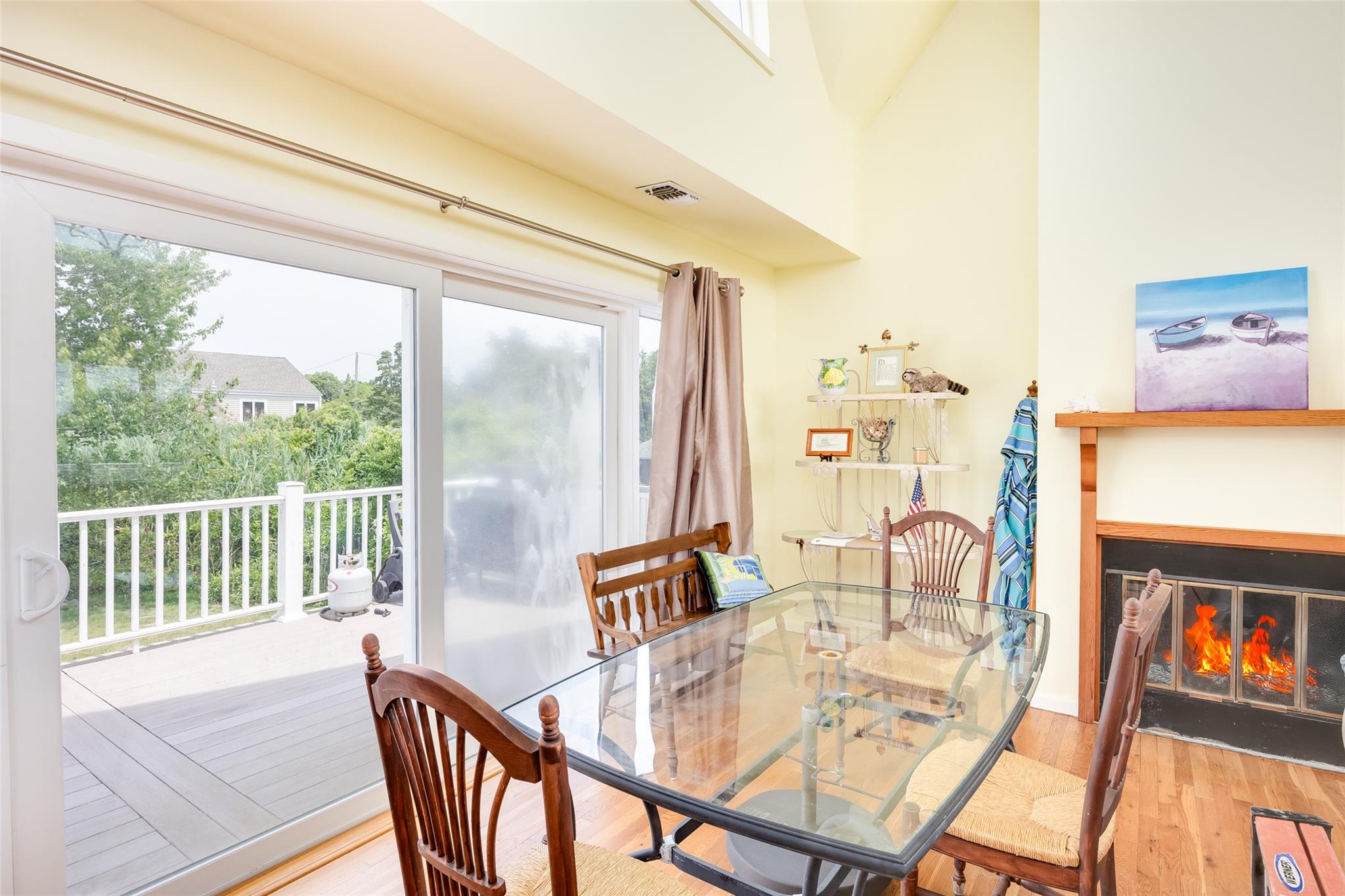 10 Bayview Road Remsenburg, NY 11960 - Photo 24 of 47 a dining room with furniture a rug and wooden floor