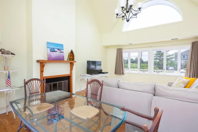 a living room with furniture fireplace and a flat screen tv