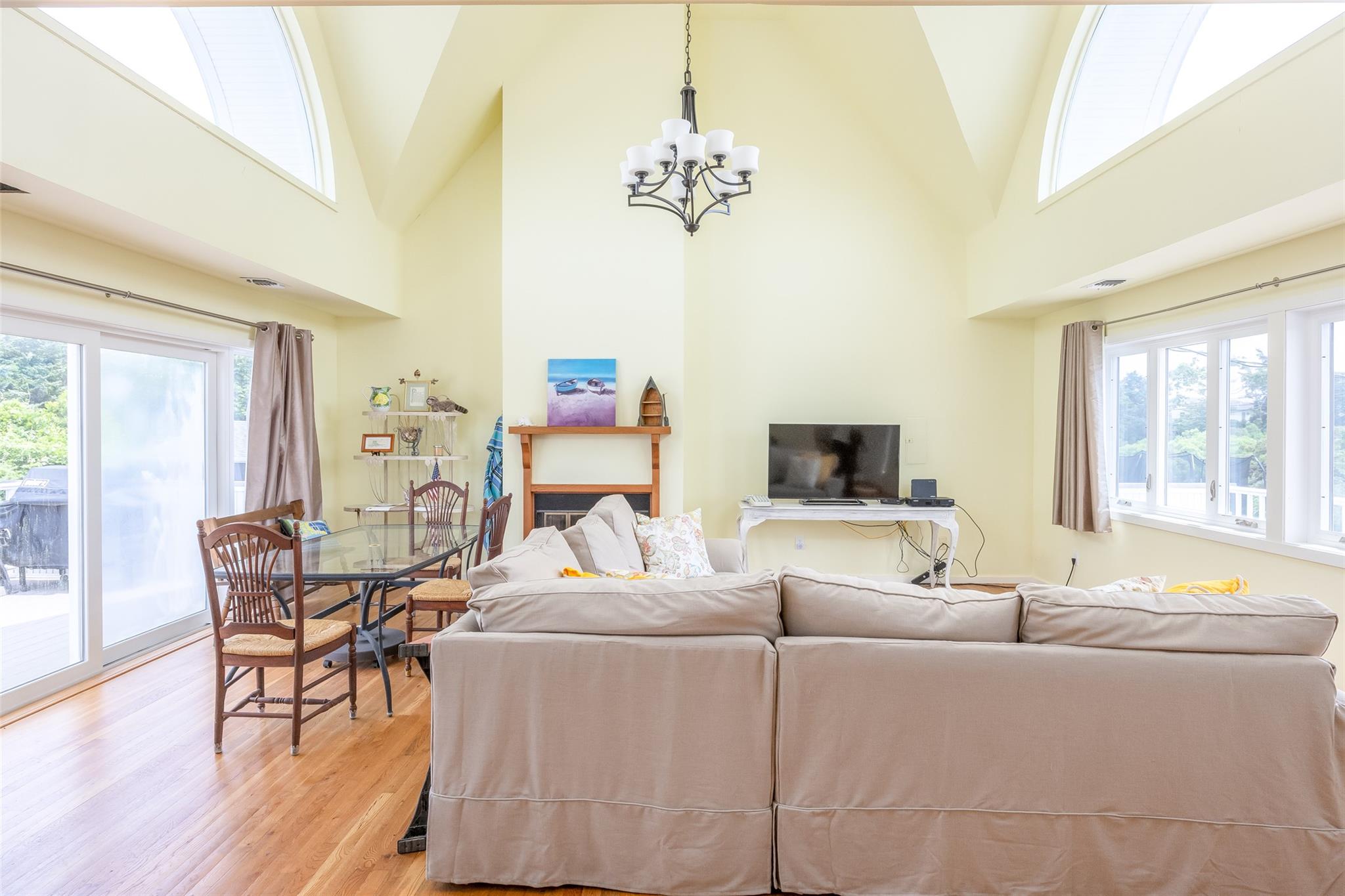 10 Bayview Road Remsenburg, NY 11960 - Photo 27 of 47 a living room with furniture and a flat screen tv