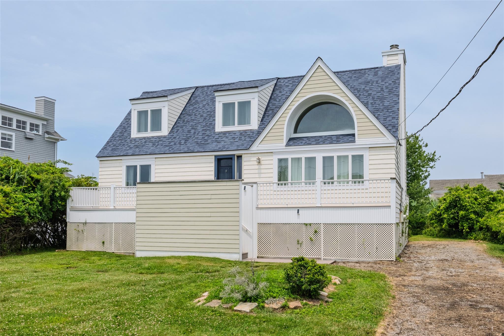 10 Bayview Road Remsenburg, NY 11960 - Photo 3 of 47 a front view of a house with a yard