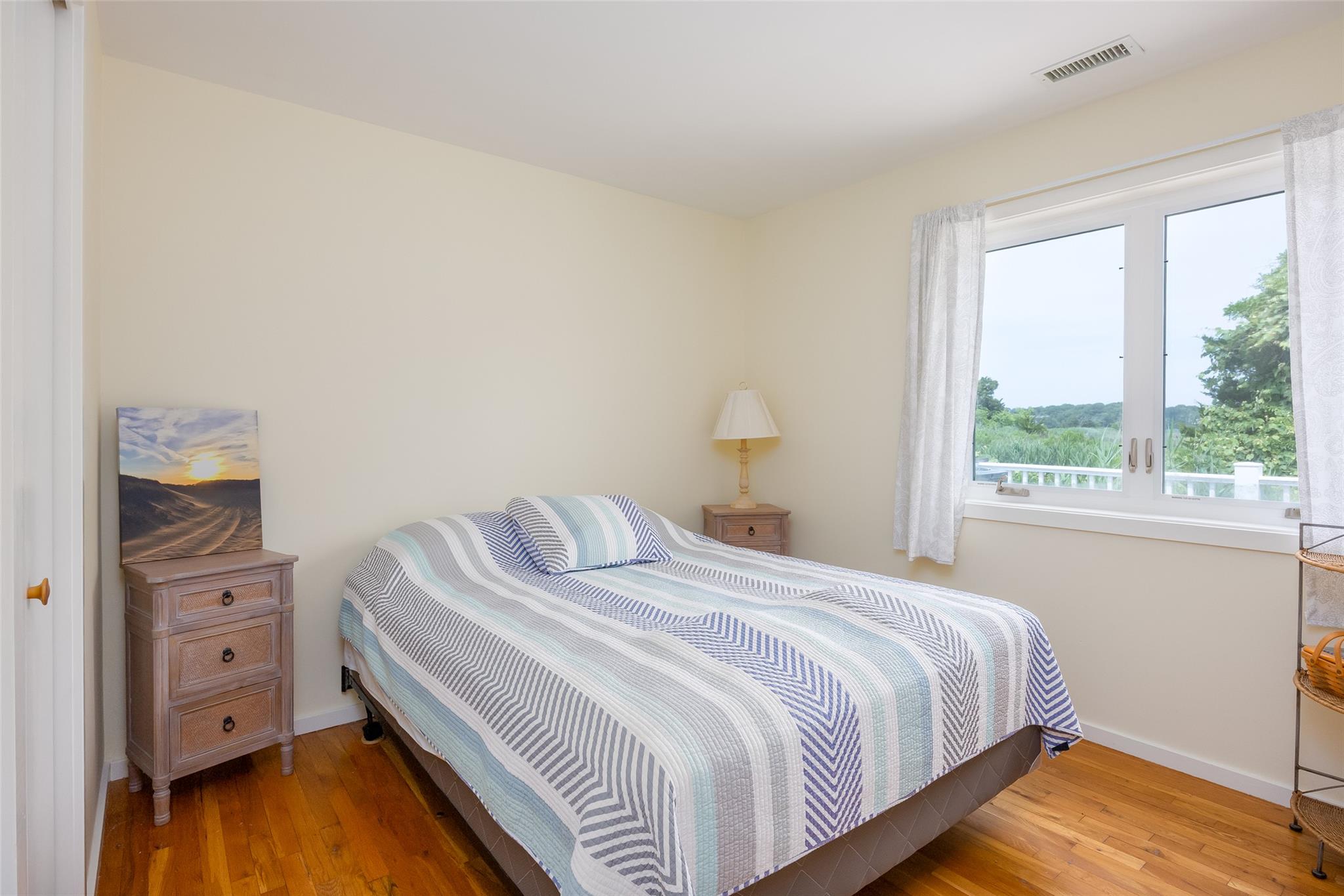10 Bayview Road Remsenburg, NY 11960 - Photo 33 of 47 a bedroom with a bed and a window