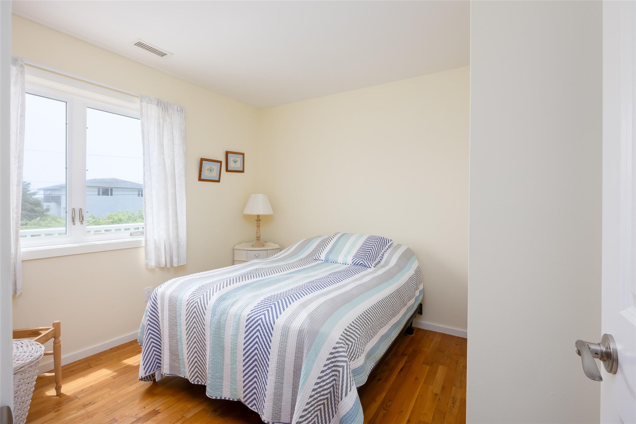 10 Bayview Road Remsenburg, NY 11960 - Photo 35 of 47 a bedroom with a bed and a window