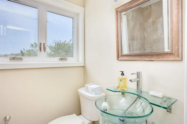 a bathroom with a toilet and a sink