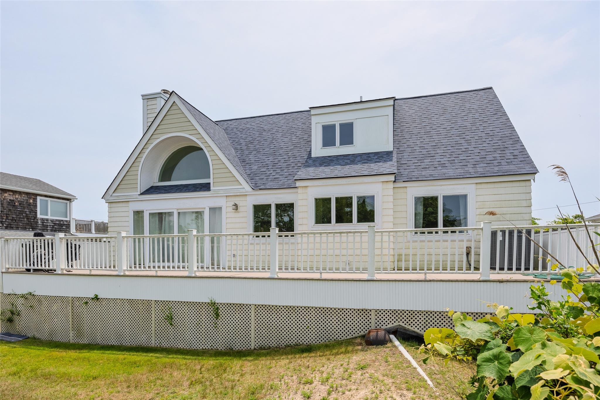 10 Bayview Road Remsenburg, NY 11960 - Photo 5 of 47 a front view of a house with a swimming pool