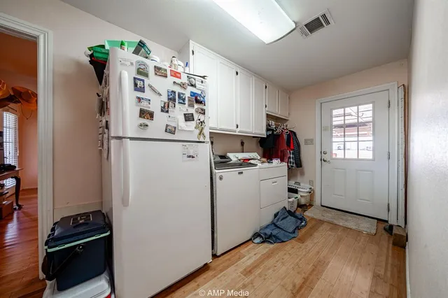 a bedroom with furniture and a flat screen tv