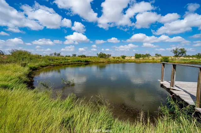 a view of a lake in between the house