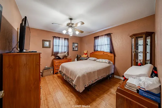 a bedroom with furniture and a window