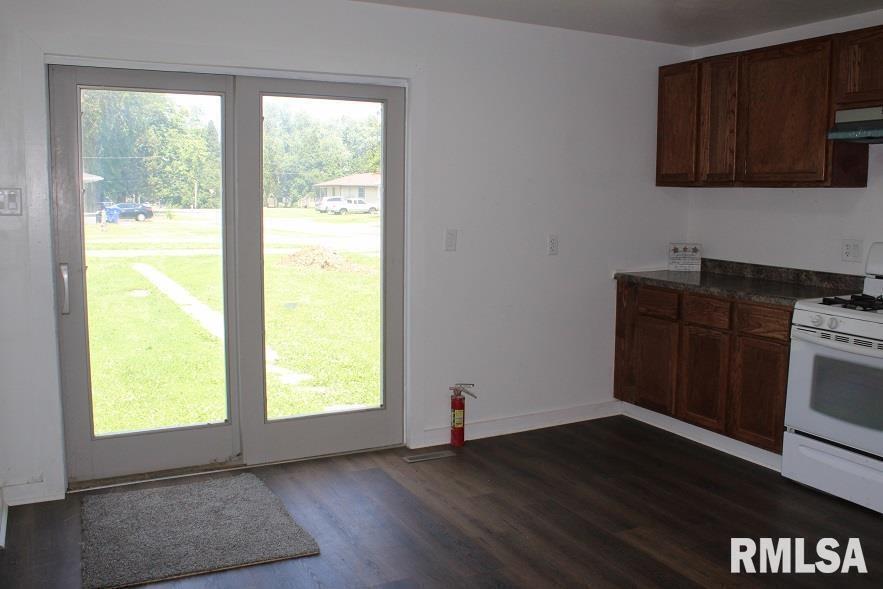 632 East 9th Street Kewanee, IL 61443 - Photo 13 of 36 a view of an empty room with wooden floor and a window