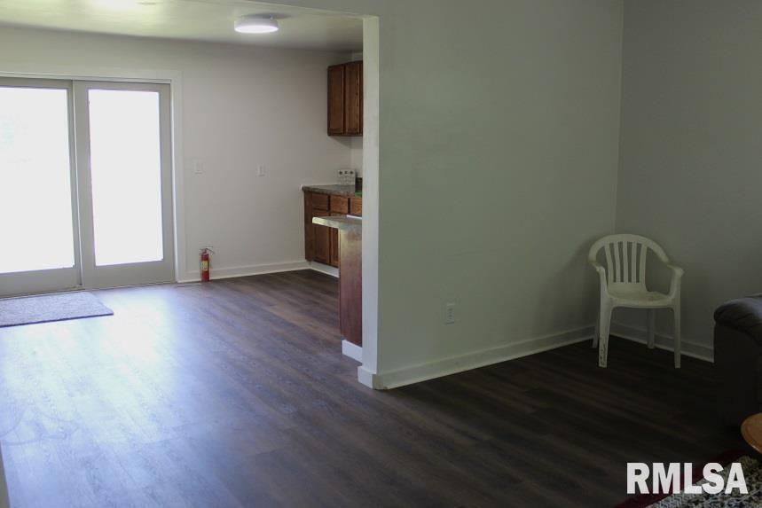 632 East 9th Street Kewanee, IL 61443 - Photo 15 of 36 a view of empty room with wooden floor and fan