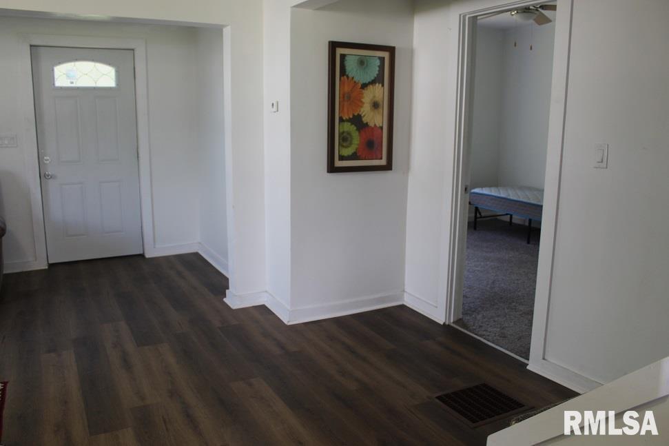 632 East 9th Street Kewanee, IL 61443 - Photo 23 of 36 an empty room with wooden floor and closet