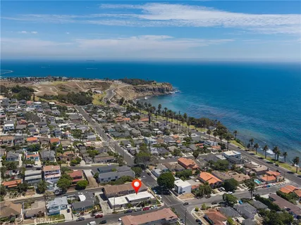 an aerial view of city and ocean