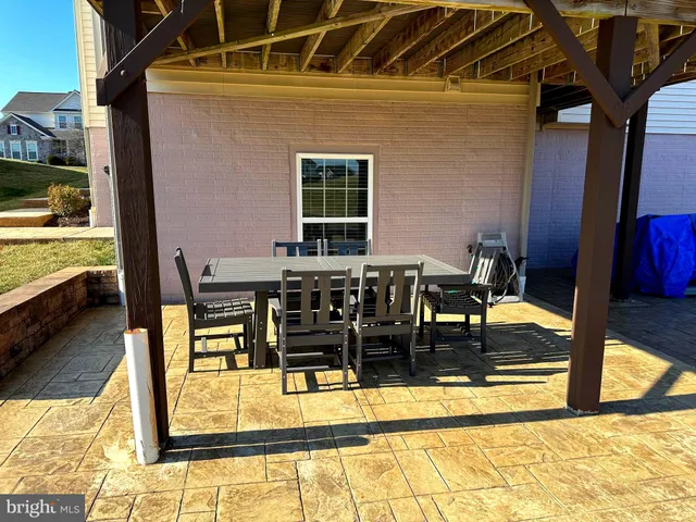 a view of a swimming pool with seating area
