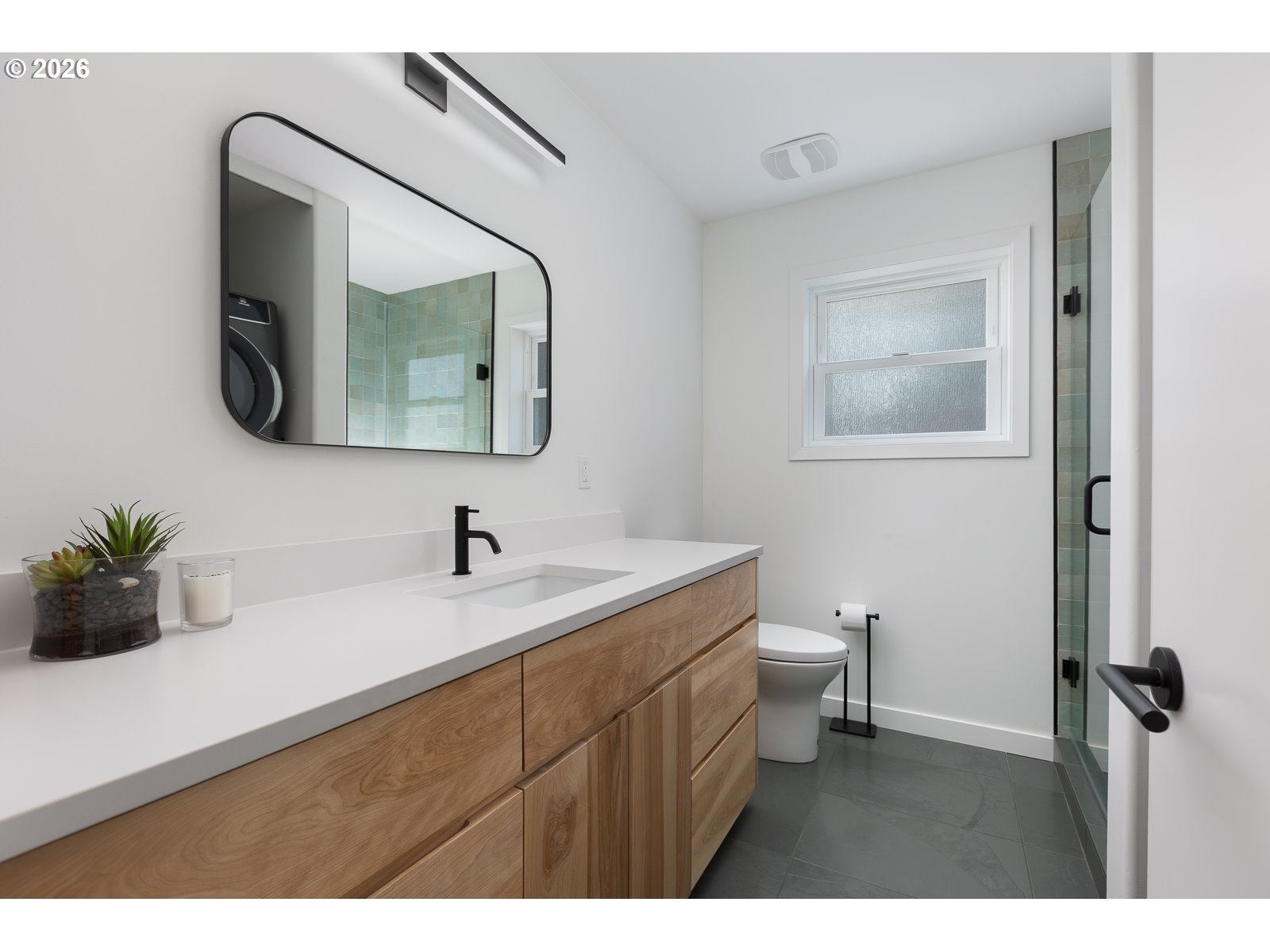 34098 Brooten Road Pacific City, OR 97135 - Photo 21 of 38 a bathroom with a toilet a sink and mirror