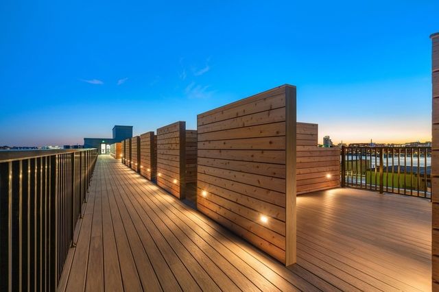 a view of balcony with wooden floor and city view