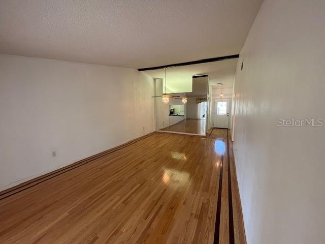1725 Pine Ridge Way East, Unit C Palm Harbor, FL 34684 - Photo 11 of 28 a view of hallway with wooden floor