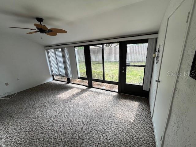 1725 Pine Ridge Way East, Unit C Palm Harbor, FL 34684 - Photo 13 of 28 a view of an empty room with a window
