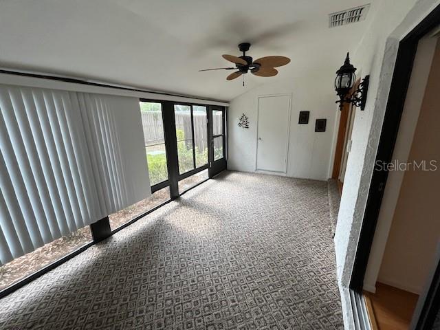 1725 Pine Ridge Way East, Unit C Palm Harbor, FL 34684 - Photo 14 of 28 wooden floor in an empty room with a window