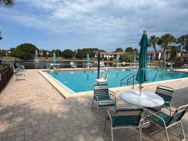 1725 Pine Ridge Way East, Unit C Palm Harbor, FL 34684 - Photo 24 of 28 a outdoor view with a sitting space
