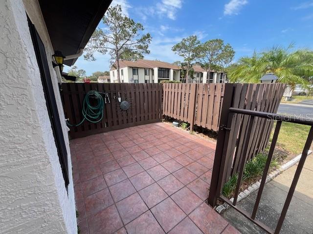 1725 Pine Ridge Way East, Unit C Palm Harbor, FL 34684 - Photo 4 of 28 a view of a backyard