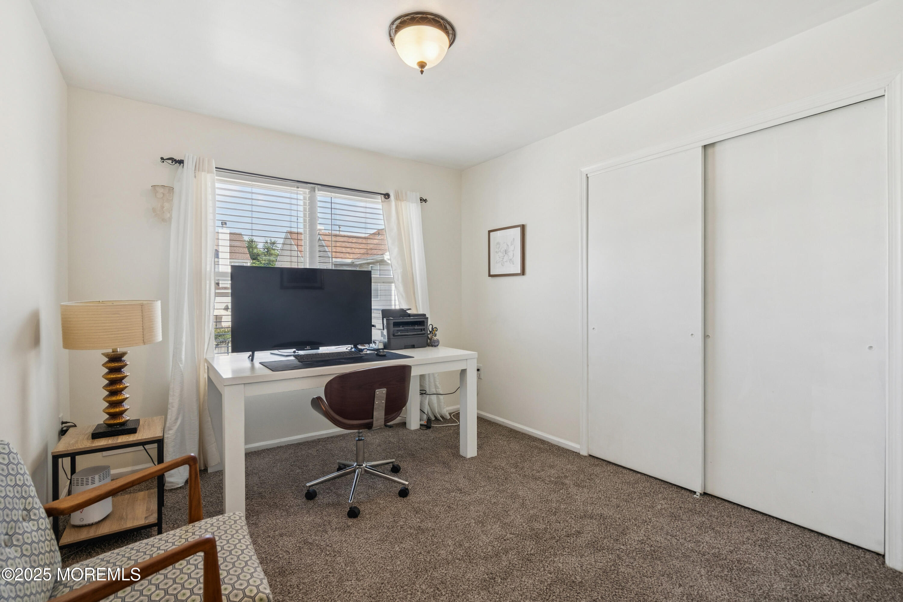 7 Devonshire Drive Hazlet, NJ 07730 - Photo 15 of 19 a view of a livingroom with furniture and a flat screen tv