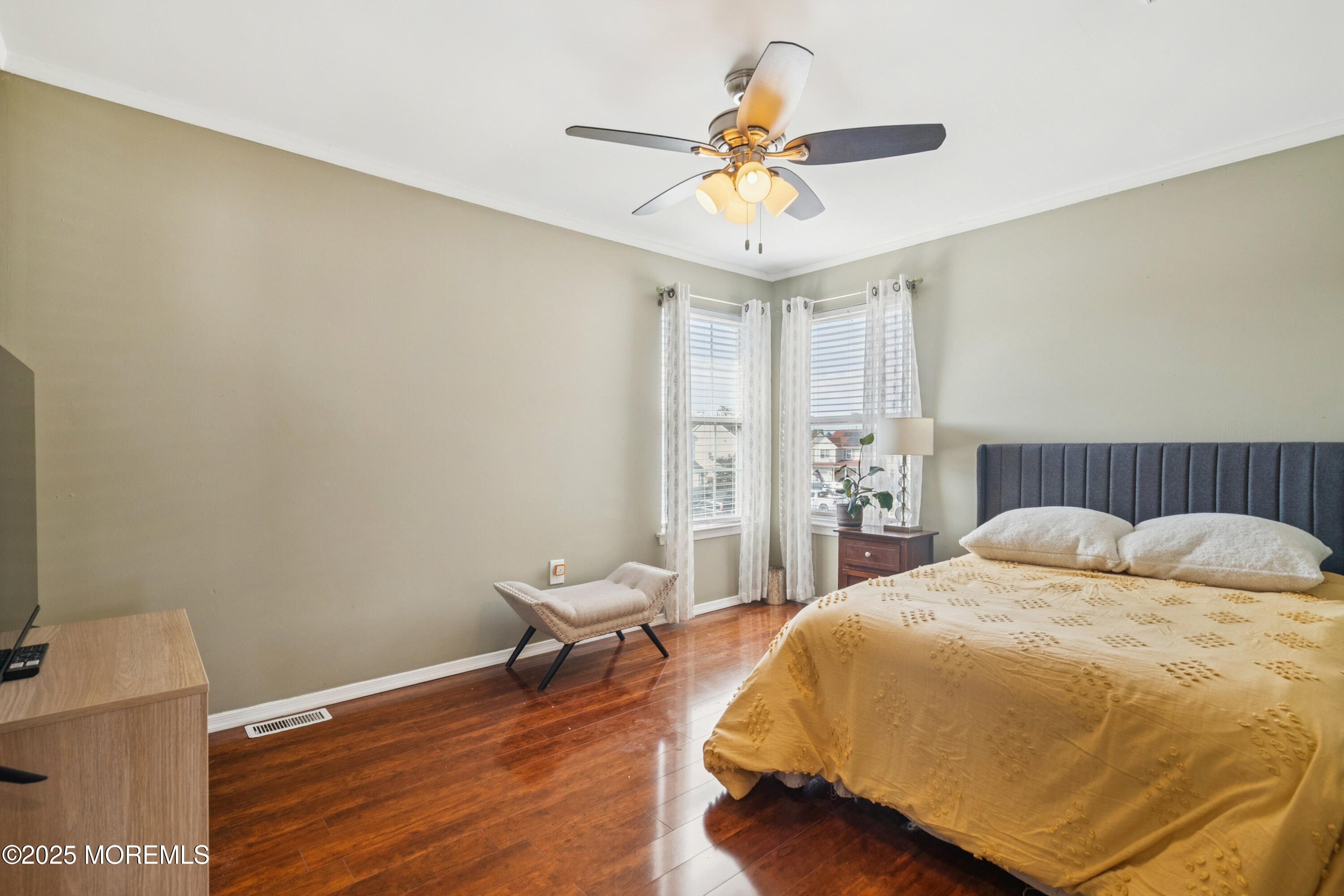 7 Devonshire Drive Hazlet, NJ 07730 - Photo 16 of 19 a bedroom with a bed and a chandelier