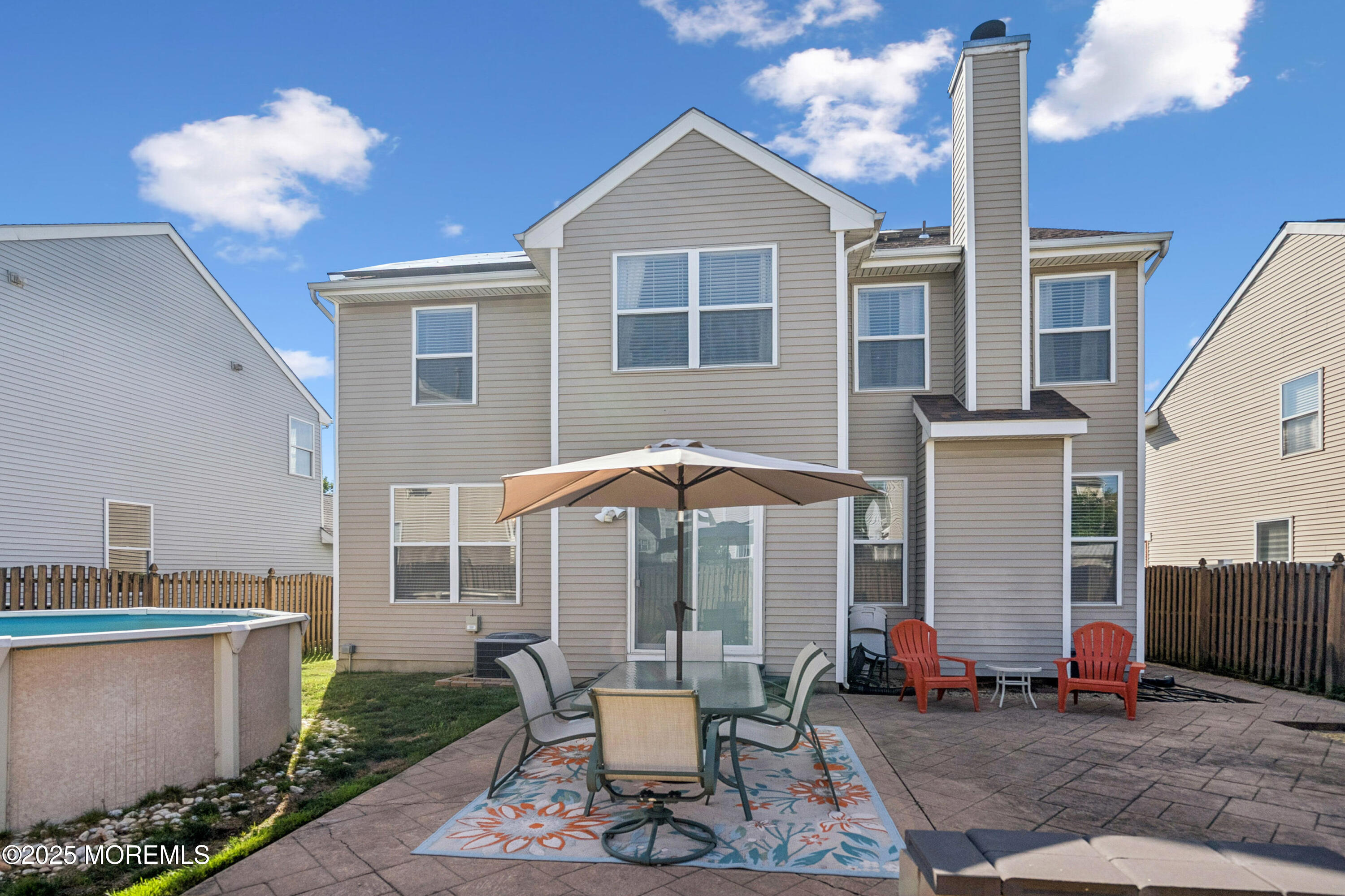 7 Devonshire Drive Hazlet, NJ 07730 - Photo 19 of 19 a patio with table and chairs and potted plants