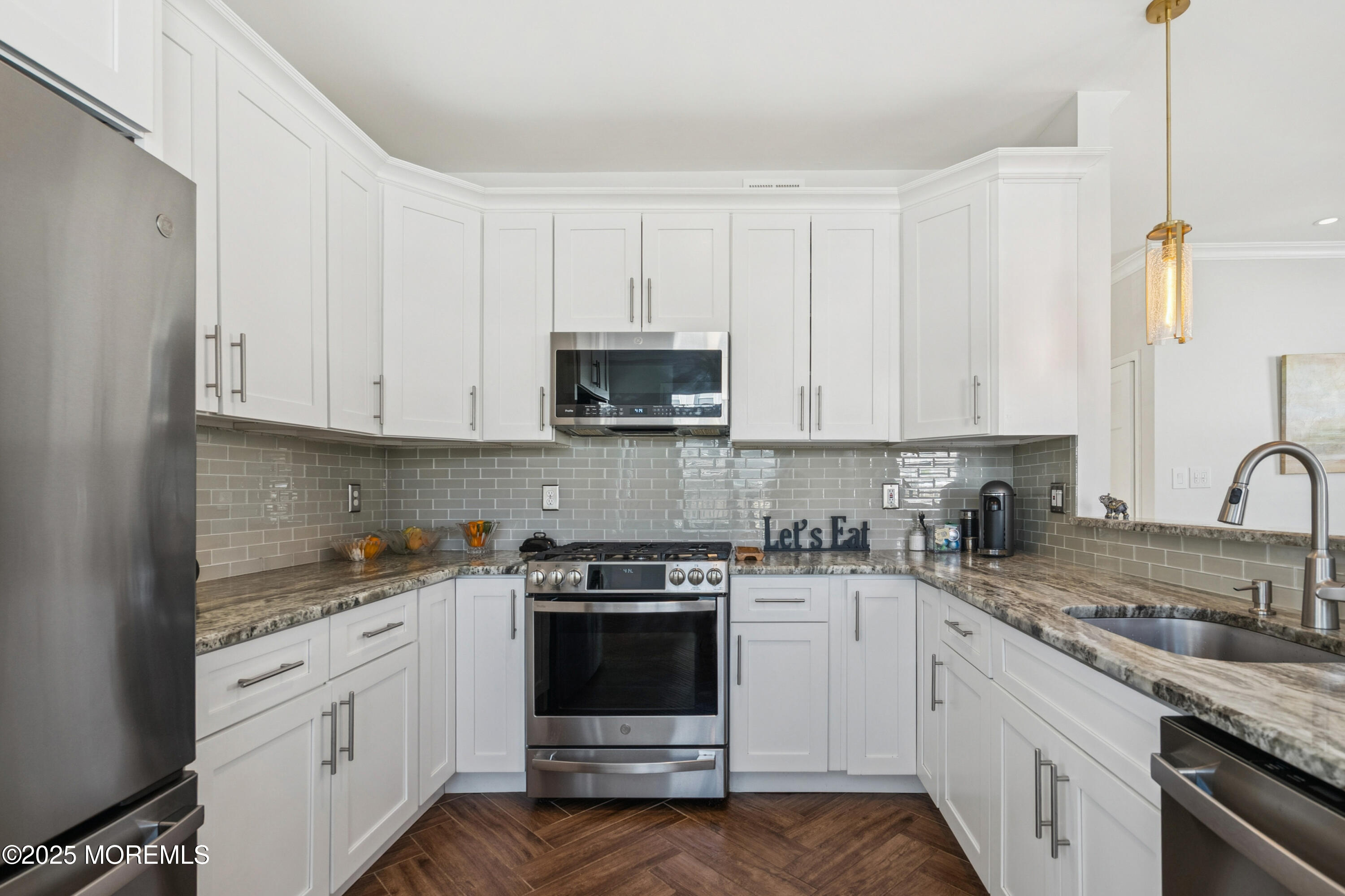 7 Devonshire Drive Hazlet, NJ 07730 - Photo 5 of 19 a kitchen with granite countertop white cabinets and white appliances
