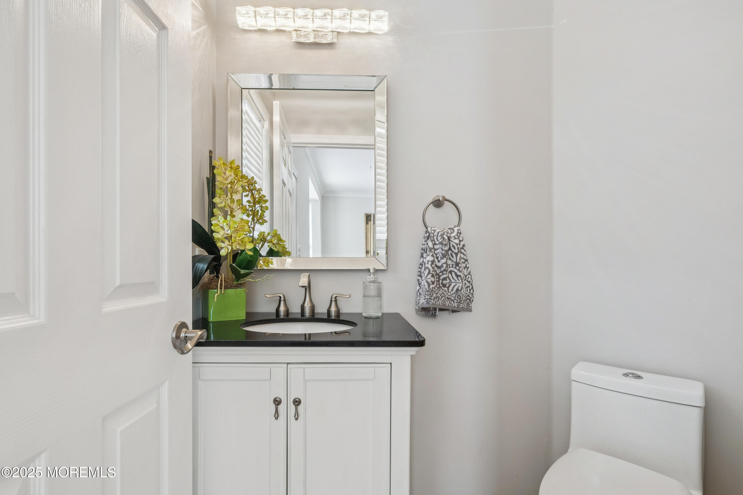 7 Devonshire Drive Hazlet, NJ 07730 - Photo 9 of 19 a bathroom with a granite countertop sink and a mirror