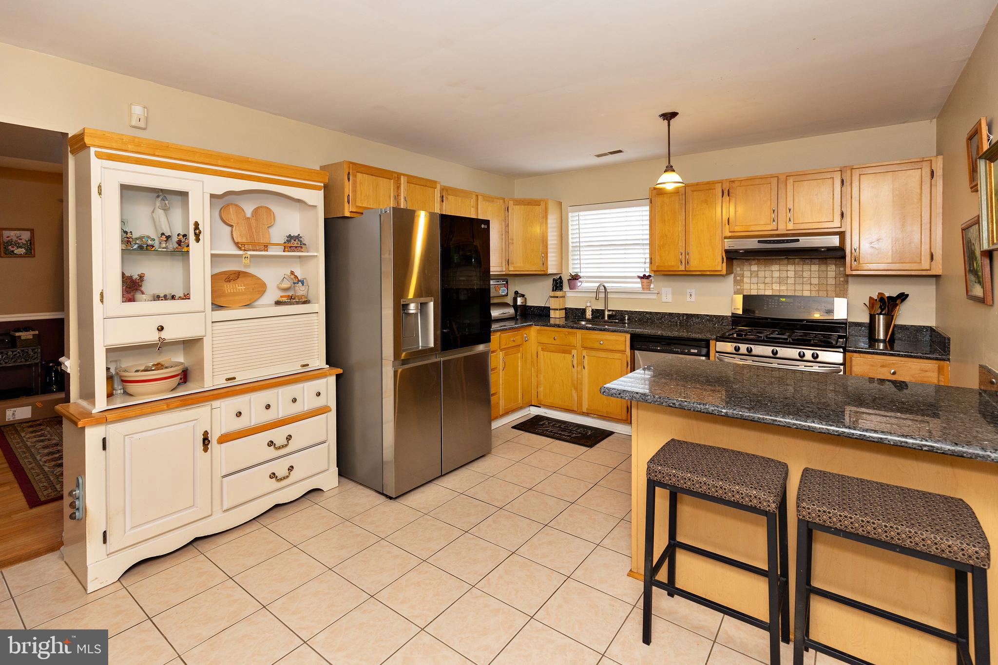 50 Haverford Road Runnemede, NJ 08078 - Photo 11 of 34 a kitchen with stainless steel appliances granite countertop a refrigerator and a stove top oven