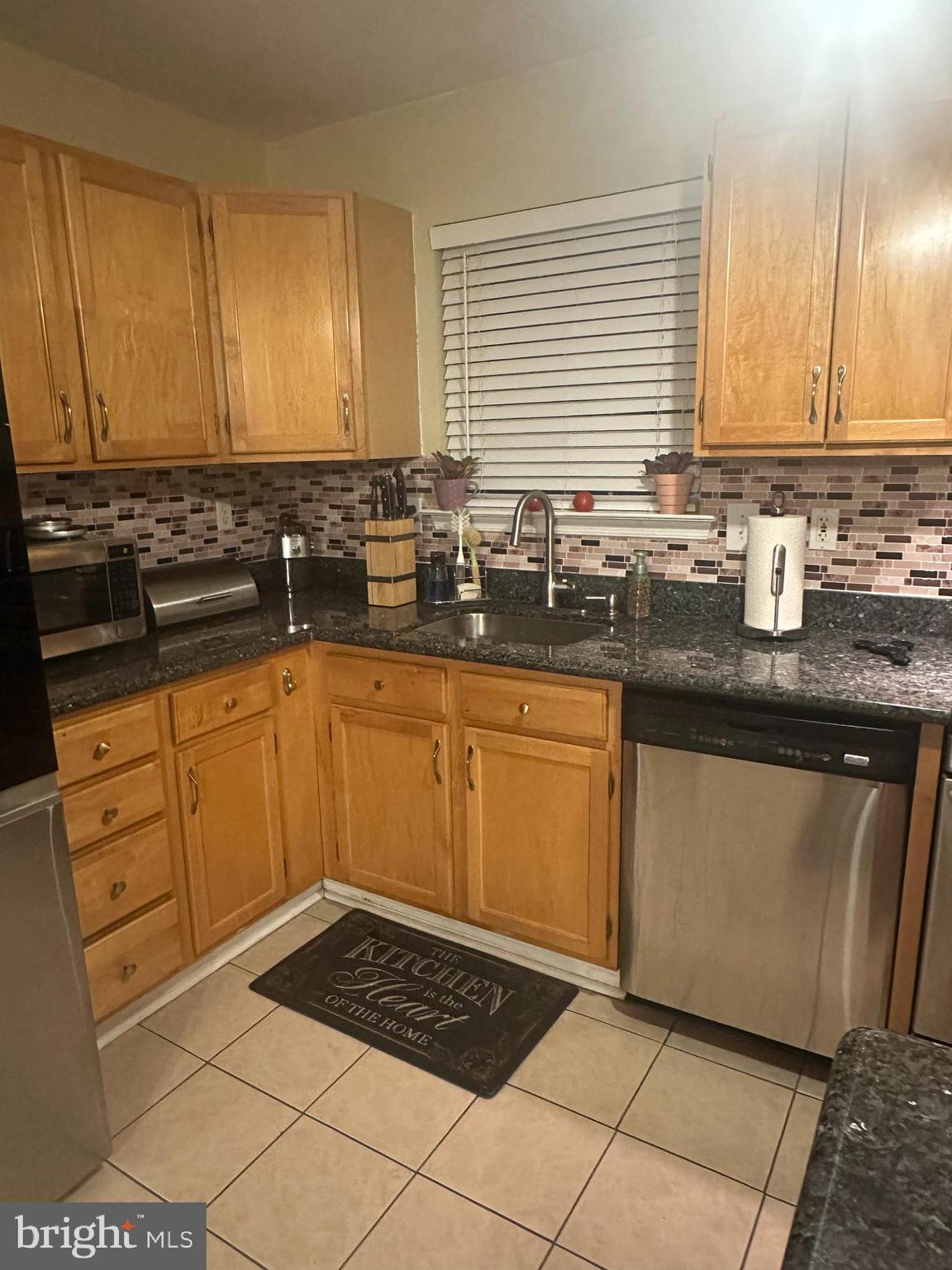 50 Haverford Road Runnemede, NJ 08078 - Photo 15 of 34 a kitchen with stainless steel appliances granite countertop a sink stove and cabinets