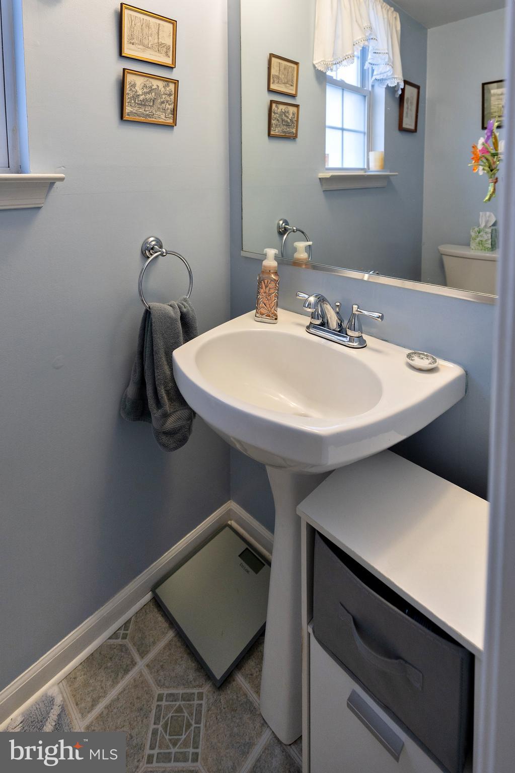 50 Haverford Road Runnemede, NJ 08078 - Photo 20 of 34 a bathroom with a sink a toilet and mirror