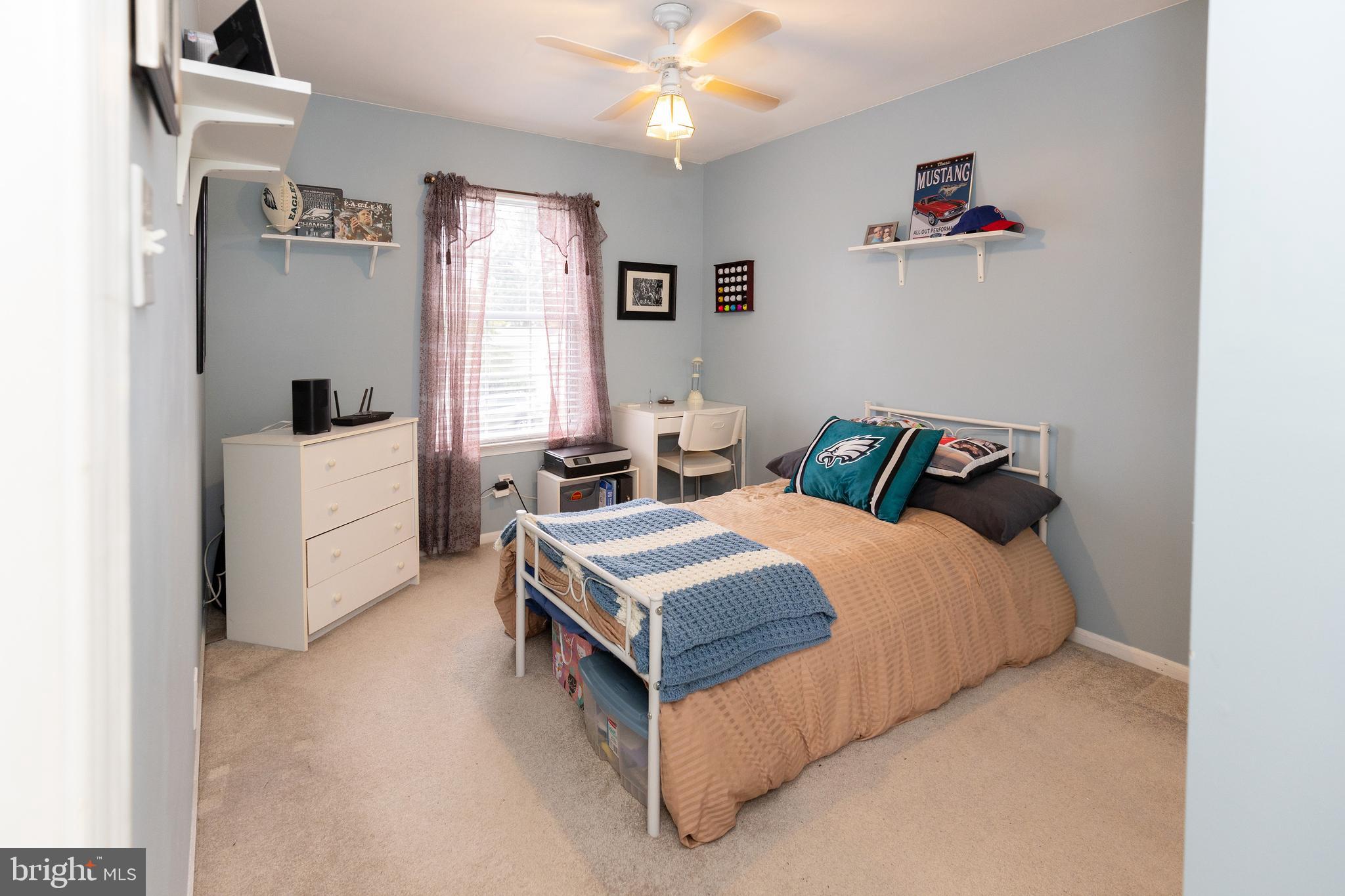 50 Haverford Road Runnemede, NJ 08078 - Photo 26 of 34 a bedroom with a bed and a chandelier