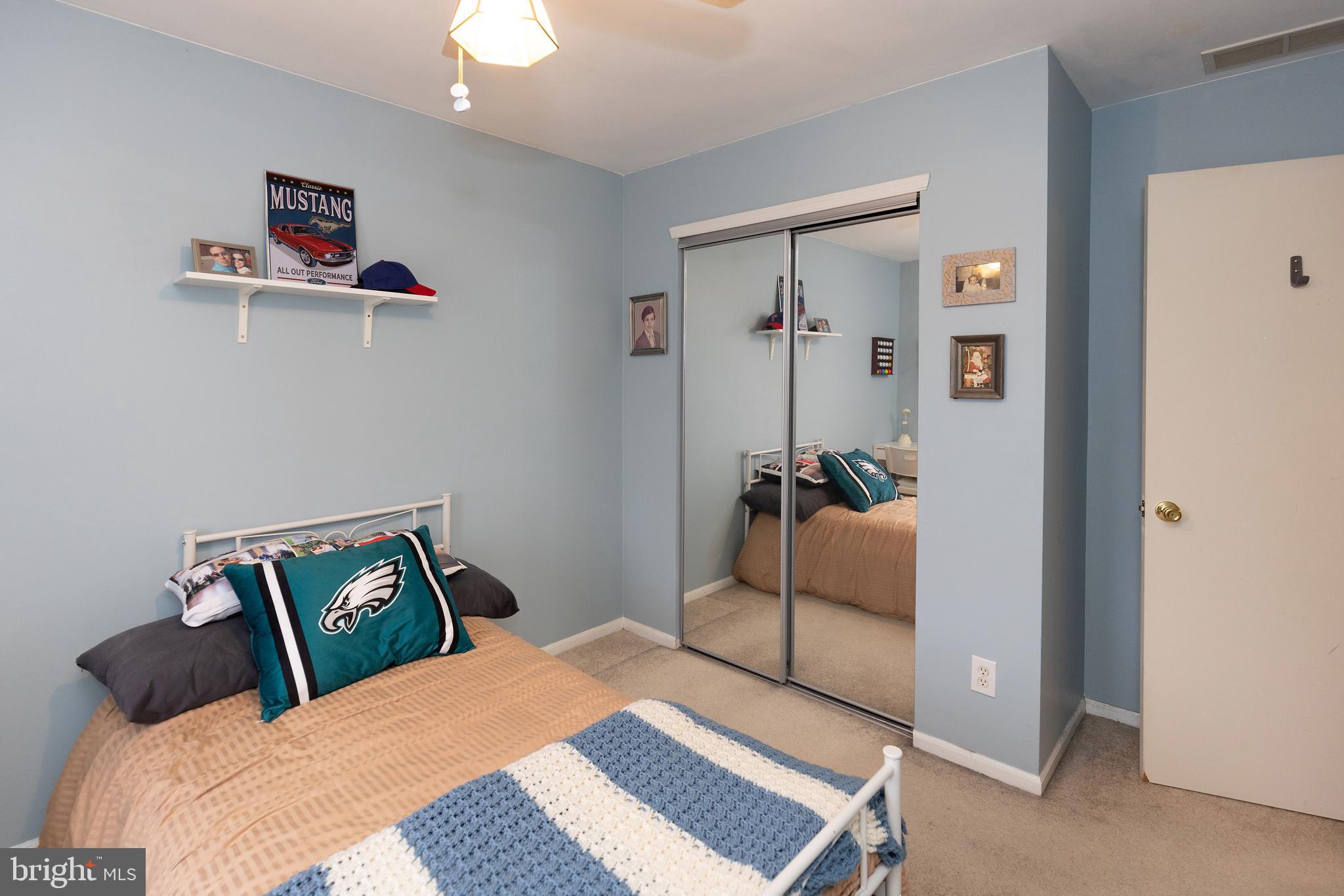 50 Haverford Road Runnemede, NJ 08078 - Photo 27 of 34 a bedroom with a bed and a chandelier