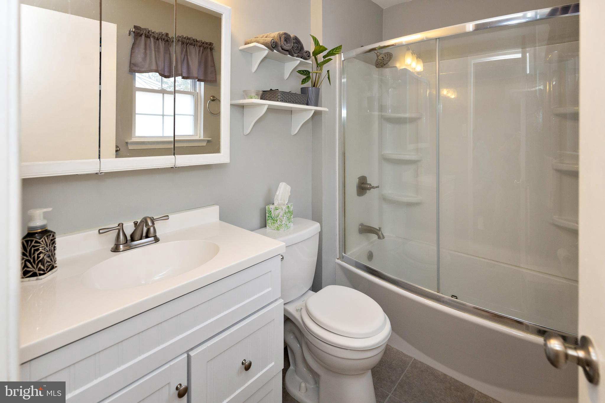 50 Haverford Road Runnemede, NJ 08078 - Photo 28 of 34 a bathroom with a sink a toilet and shower