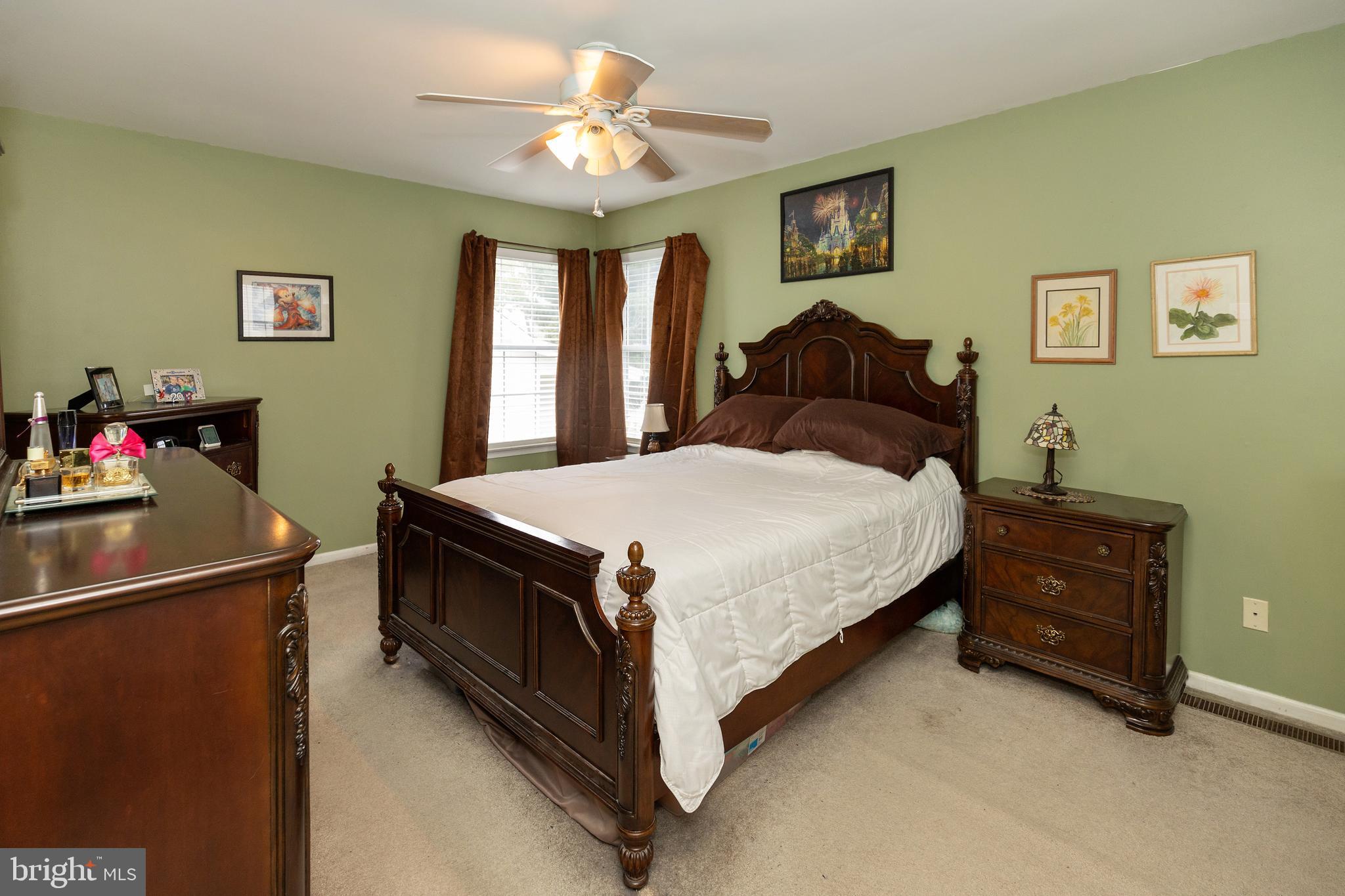 50 Haverford Road Runnemede, NJ 08078 - Photo 30 of 34 a bedroom with a bed and a chandelier