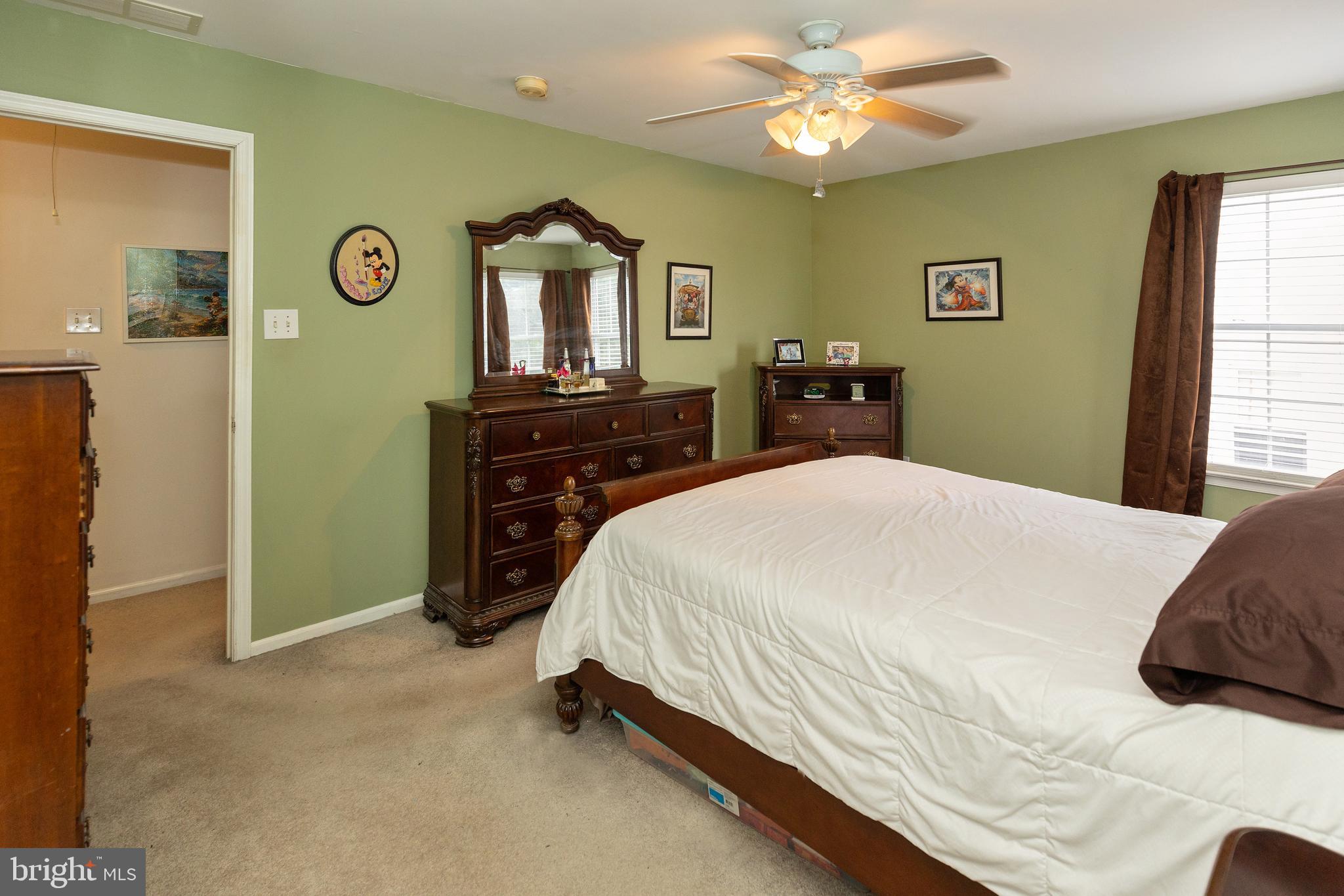50 Haverford Road Runnemede, NJ 08078 - Photo 31 of 34 a bedroom with a bed and a chandelier