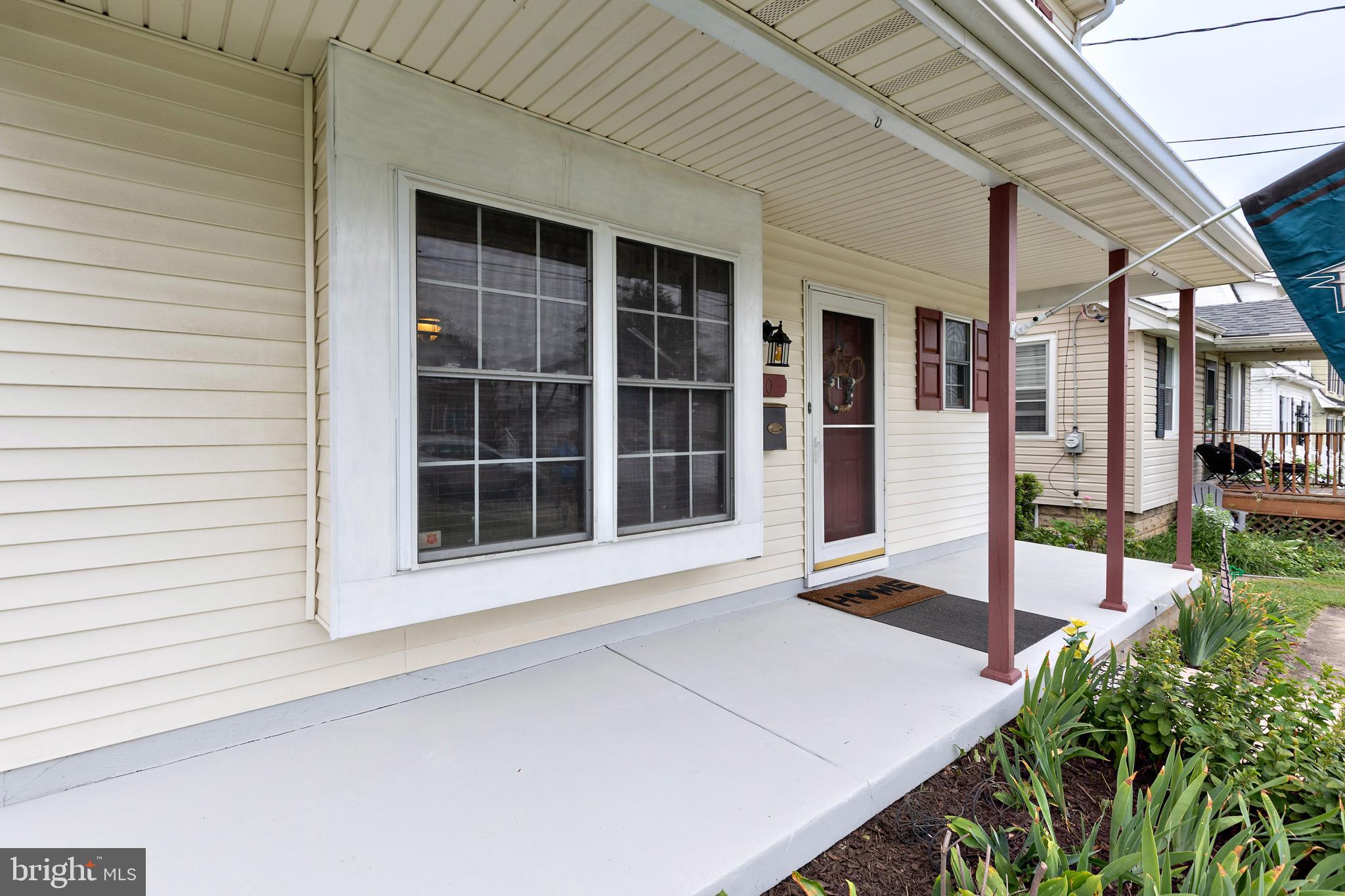 50 Haverford Road Runnemede, NJ 08078 - Photo 34 of 34 a front view of a house with a large window and potted plants
