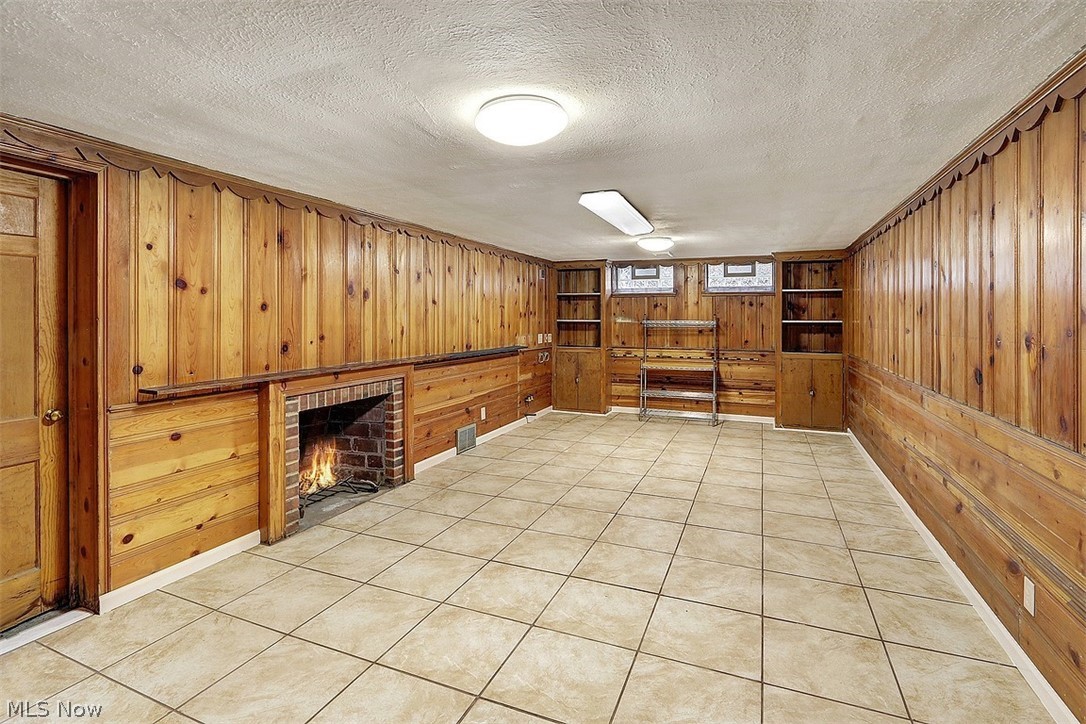 4457 Groveland Road University Heights, OH 44118 - Photo 22 of 24 Plenty of storage. This room would make a nice home office, exercise room or studio. The fire in the fireplace is the photographer's depiction. The homeowner has not used it and does not know if it works.
