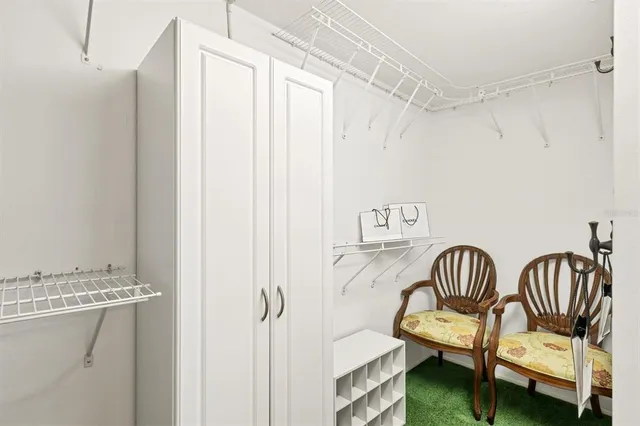 a bedroom with a bed and a table