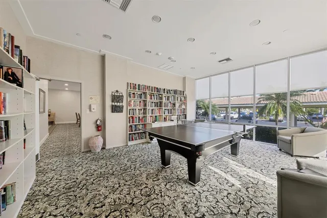 a room with furniture a rug and white walls
