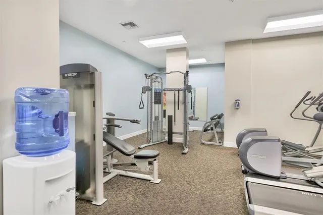 a view of a livingroom with furniture and windows